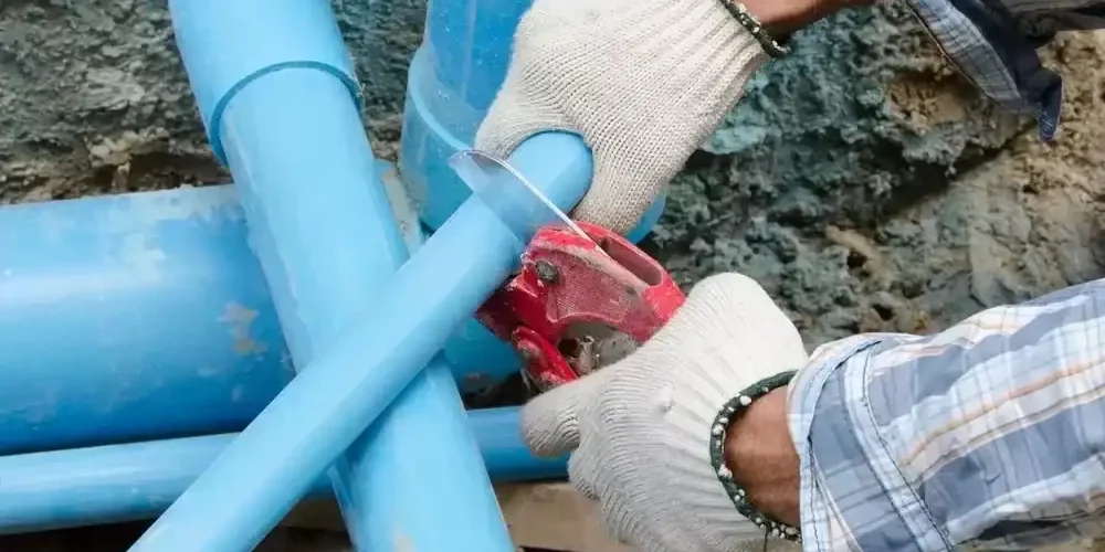 Professional-Plumbing-Service-Installing-Blue-PVC-Water-Line-Junction-Fittings